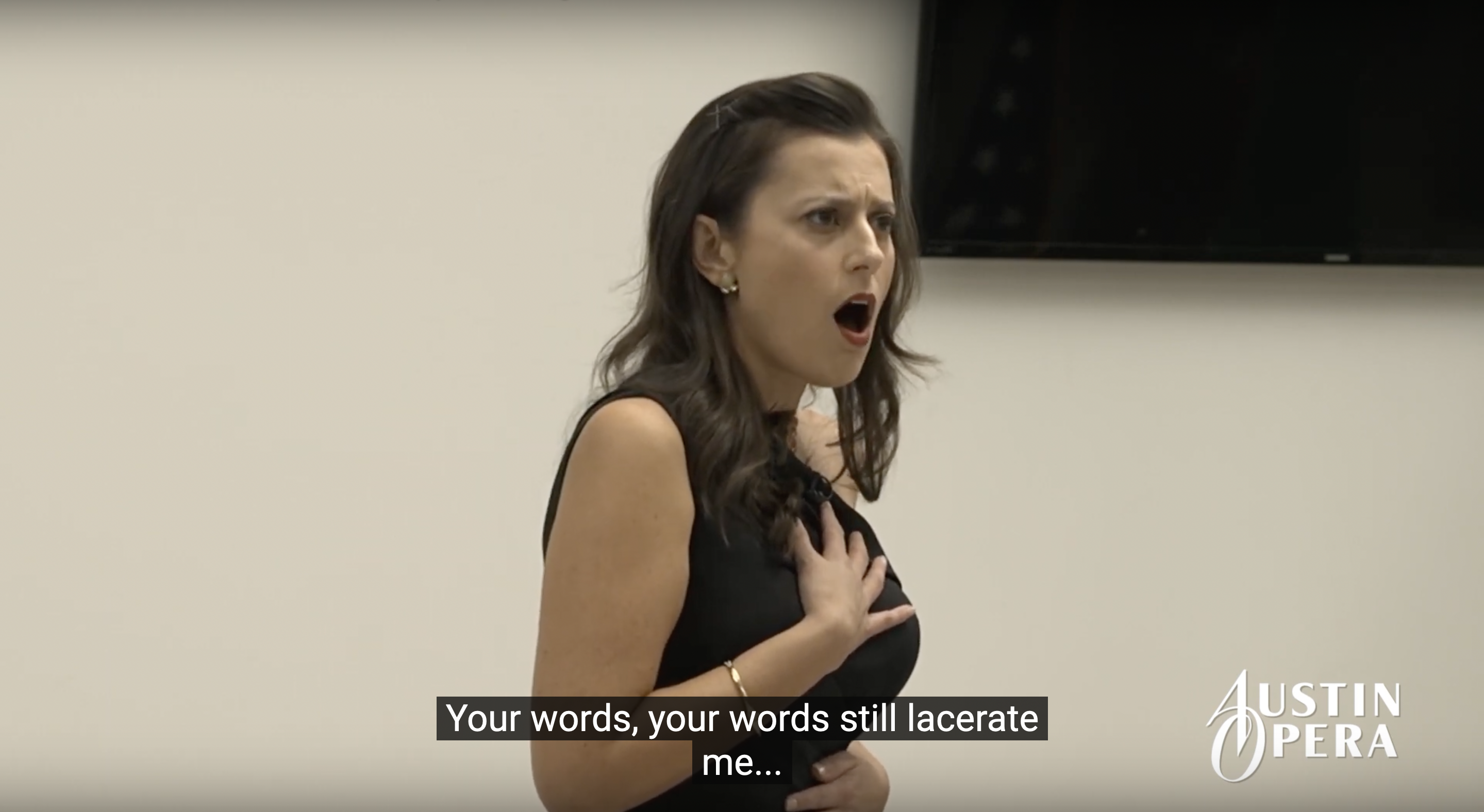 Soprano Megan Pachecano singing in a concert with Austin Opera at the Consulate General of Mexico.